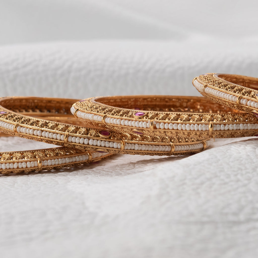 Trendy Flat Bangles with Pearls in Center (Set of 4)